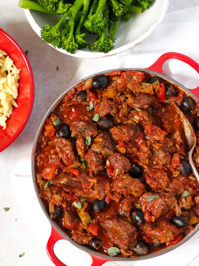 Pork casserole in tomato sauce with orzo pasta and tender stem broccoli
