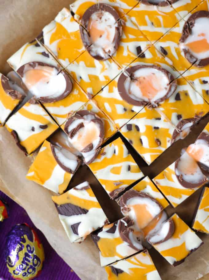 Close up overhead shot of Creme Egg Fudge drizzled with chocolate.