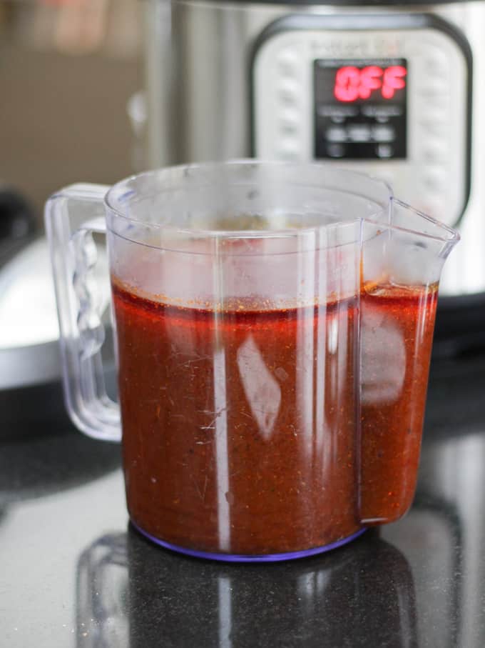 Juice from cooked meat in a gravy separator jug.