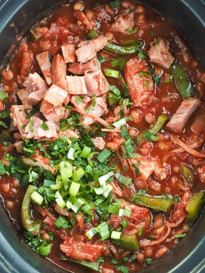 Slow cooker ham joint with beans and tomato sauce.