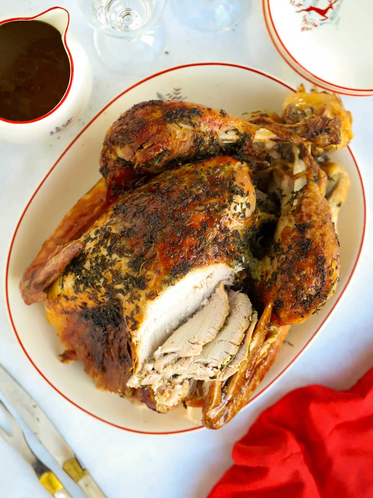 Roast turkey on the Christmas dinner table, partly carved.