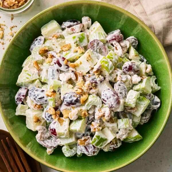 A chopped Walford Salad in a green bowl, with a mayo and Greek yoghurt dressing.